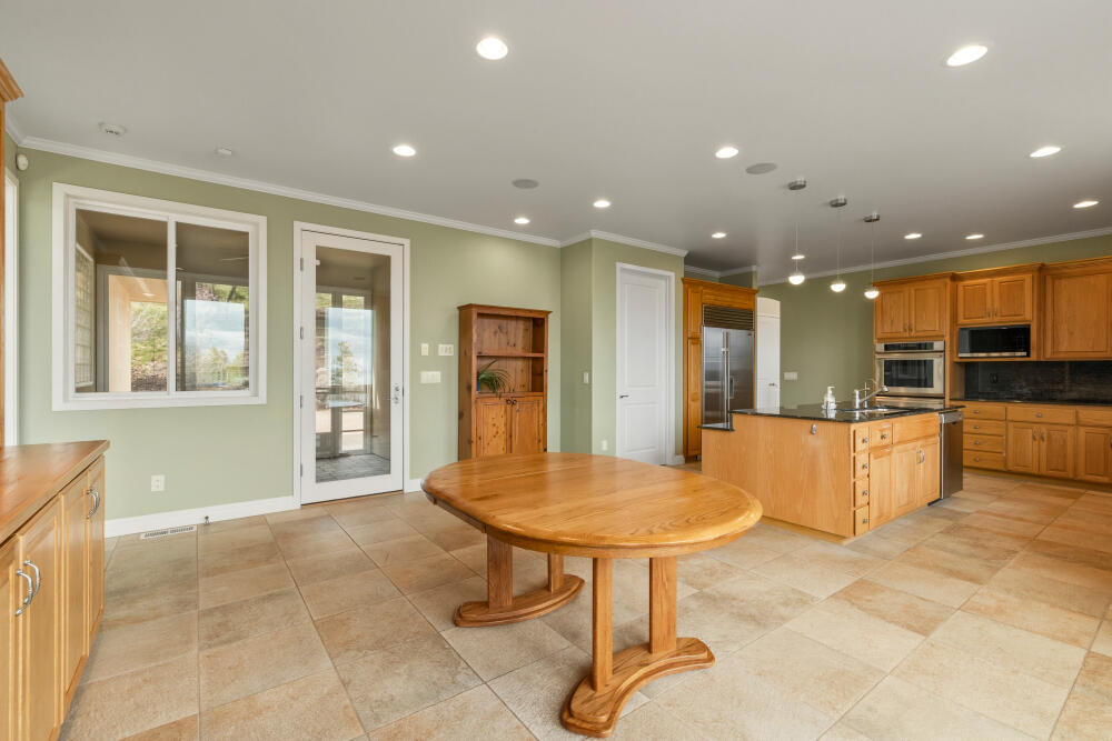 6586 Cooper's Hawk Road Klamath Falls, OR 97601 - Photo 19 of 68 a view of kitchen with furniture and a refrigerator