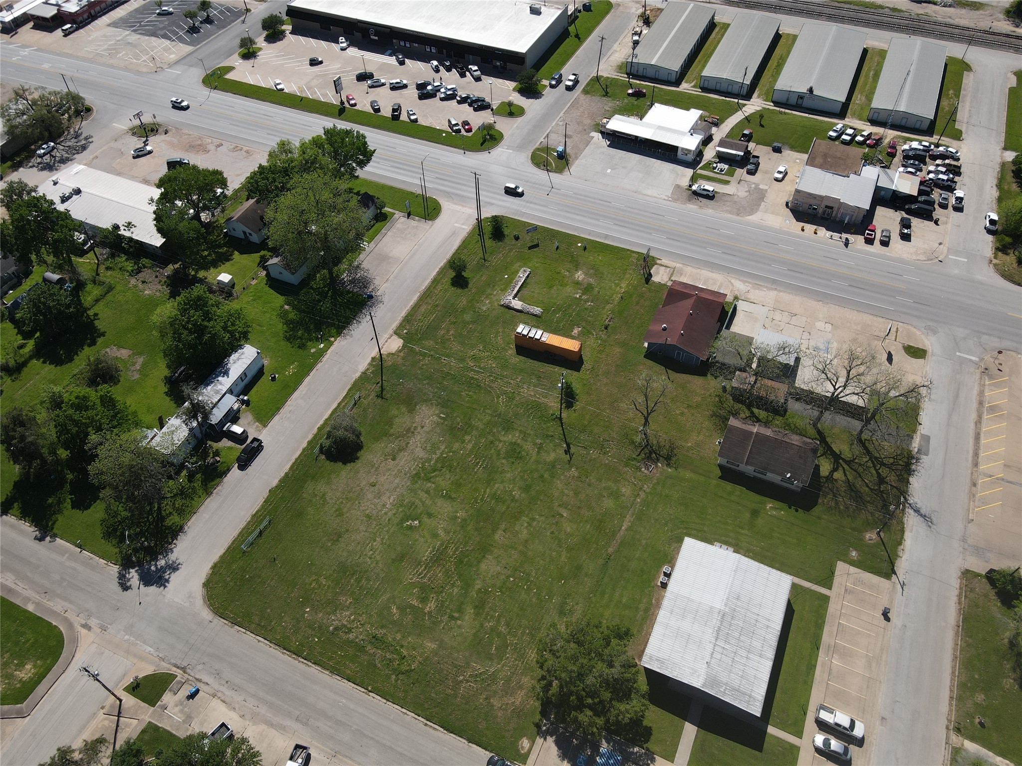 936 New Orleans Street Hempstead, TX 77445 - Photo 10 of 11 an aerial view of a house with a garden and lake view