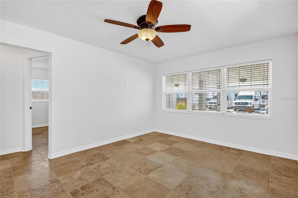 13440 1st Street East Madeira Beach, FL 33708 - Photo 14 of 44 a view of an empty room with a window