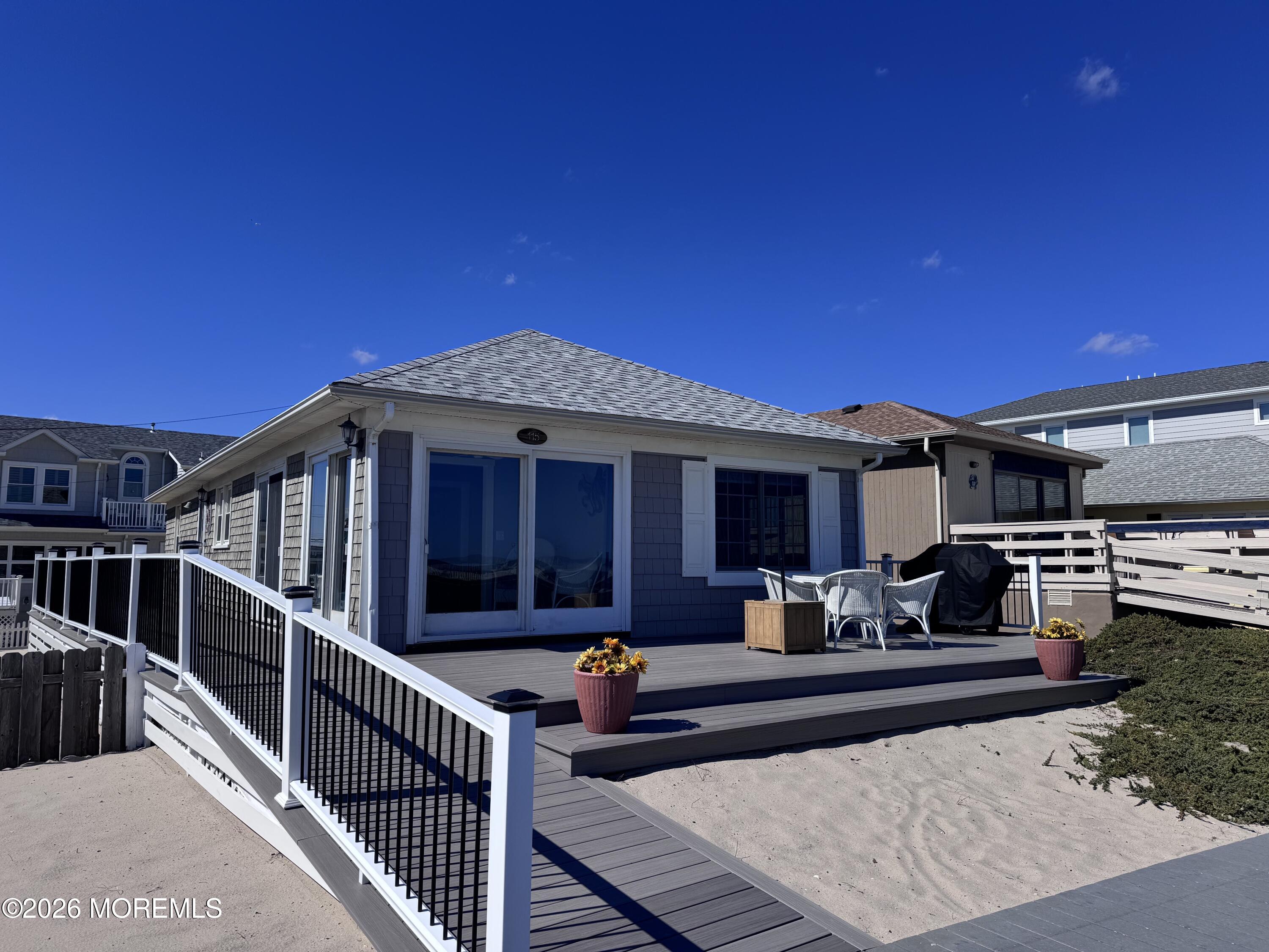 115 Boardwalk Point Pleasant Beach, NJ 08742 - Photo 4 of 23 a view of a house with a patio
