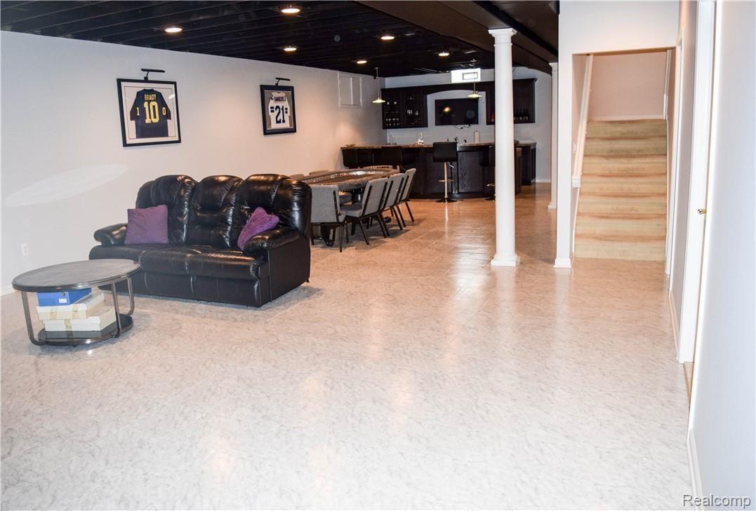 9811 Allen Road Allen Park, MI 48101 - Photo 64 of 77 CUSTOM BASEMENT DESIGNED BY OWNER. MAY BE USED AS GREAT ENTERTAINMENT SPACE AND/OR FAMILY ROOM