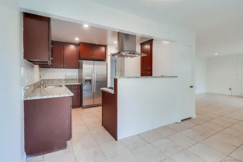 a kitchen with stainless steel appliances a refrigerator and a sink