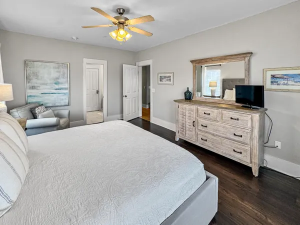 a bedroom with a bed and a dresser