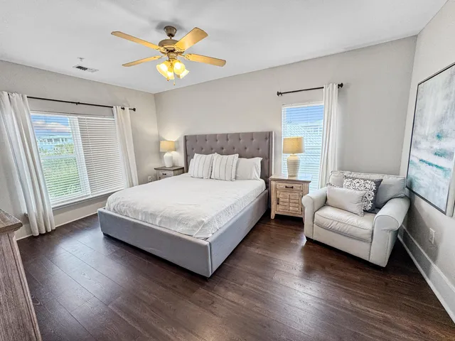 a bedroom with a bed and a couch