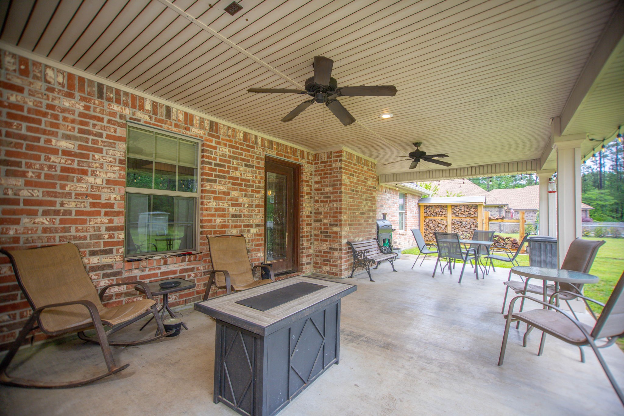 4145 Fm 770 Road Kountze, TX 77625 - Photo 11 of 38 a view of a patio with a table and chairs and a barbeque