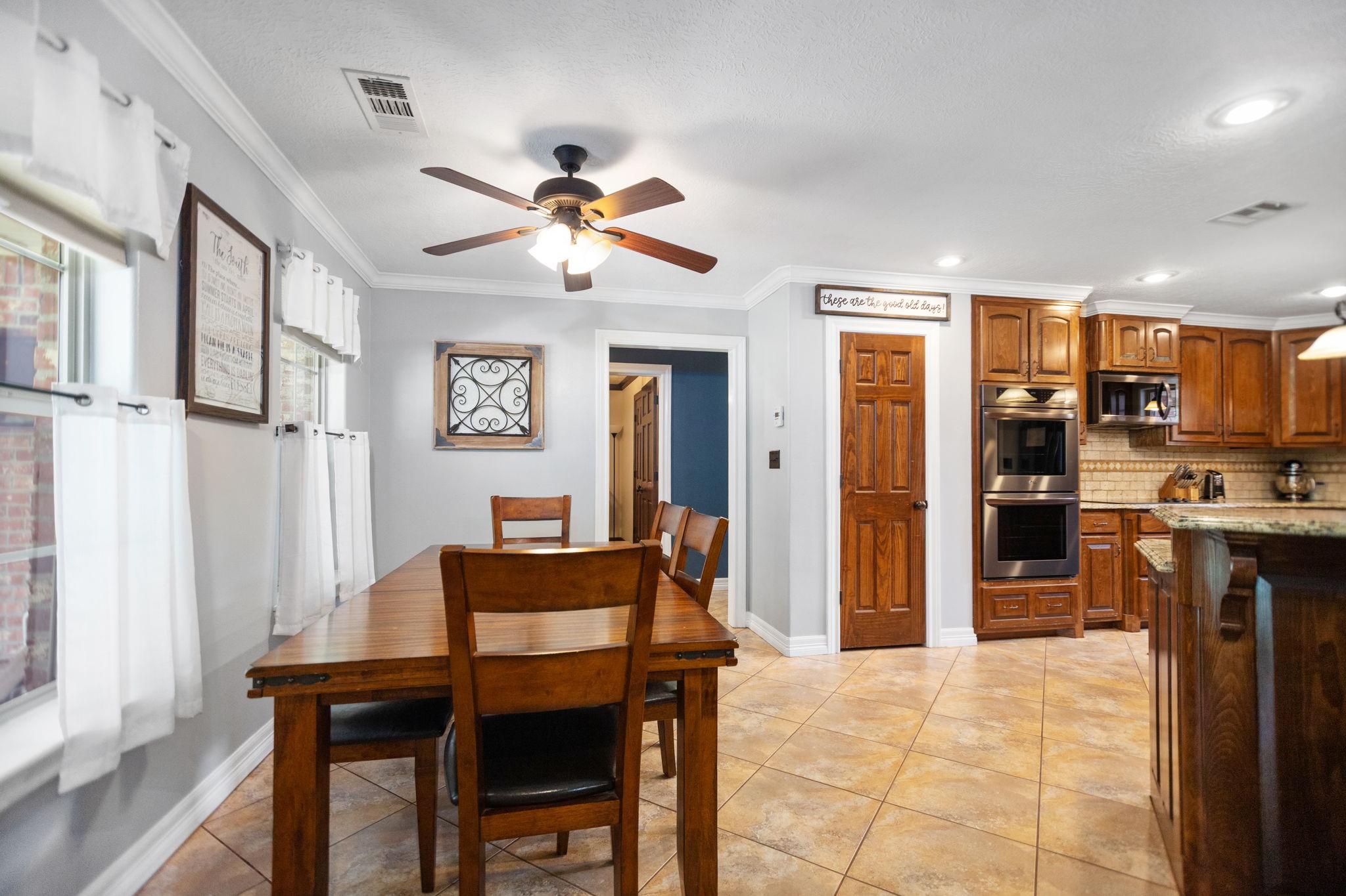 4145 Fm 770 Road Kountze, TX 77625 - Photo 18 of 38 a view of a dining room with furniture and a chandelier fan