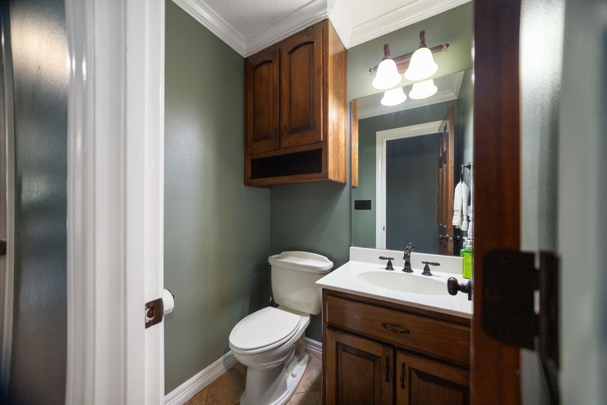 4145 Fm 770 Road Kountze, TX 77625 - Photo 29 of 38 a bathroom with a toilet sink and mirror