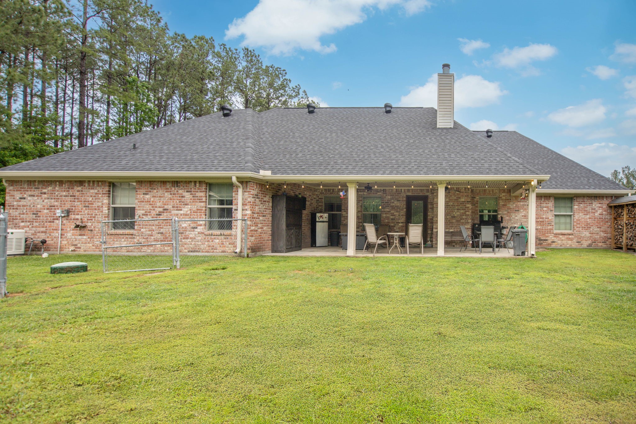 4145 Fm 770 Road Kountze, TX 77625 - Photo 9 of 38 a front view of a house with a garden