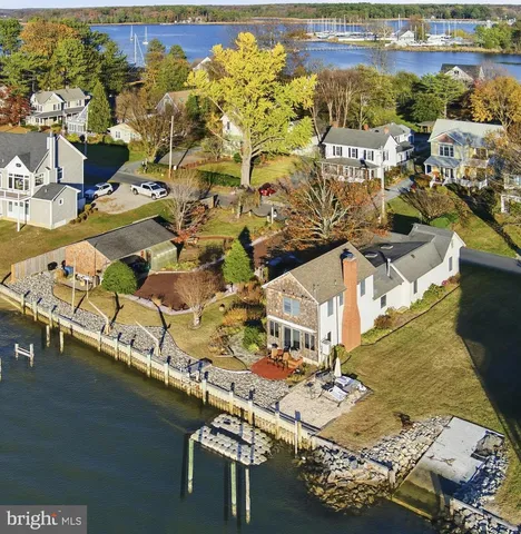 an aerial view of a house with a ocean view