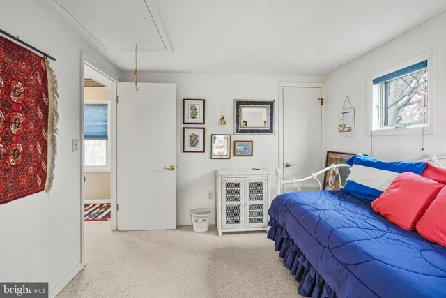 a bedroom with a bed and closet