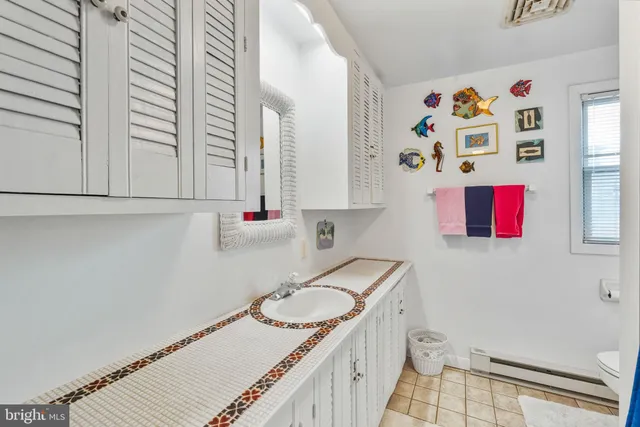 a bathroom with a sink toilet and vanity