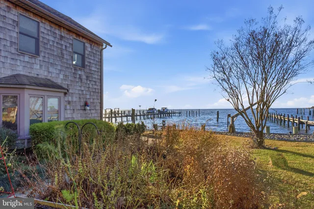 a view of a building with large garden and trees