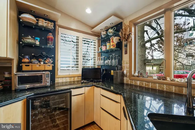 a kitchen with a stove a sink and a microwave