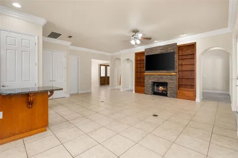 a view of livingroom with furniture fireplace and a window