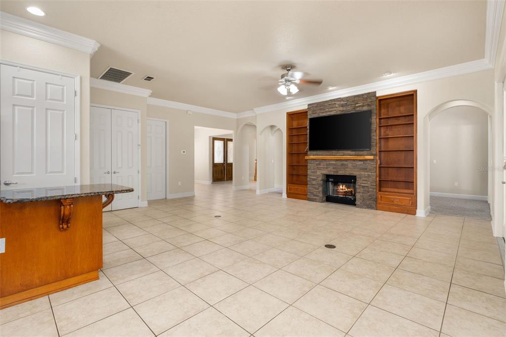 3950 Southeast 39th Circle Ocala, FL 34480 - Photo 11 of 40 a view of livingroom with furniture fireplace and a window