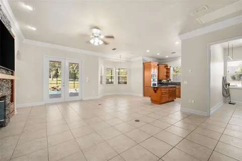 a view of a livingroom with furniture and a flat screen tv