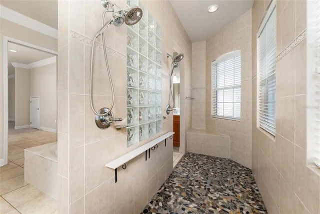 a bathroom with a bathtub and shower