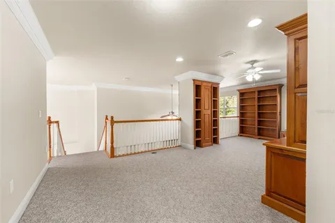 a view of an empty room with closet and en suite bathroom