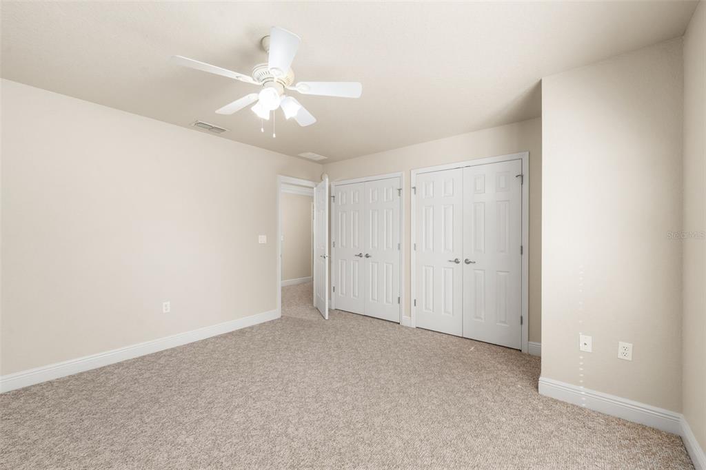 3950 Southeast 39th Circle Ocala, FL 34480 - Photo 30 of 40 a view of an empty room with a ceiling fan