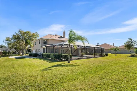 a view of a house with swimming pool and porch