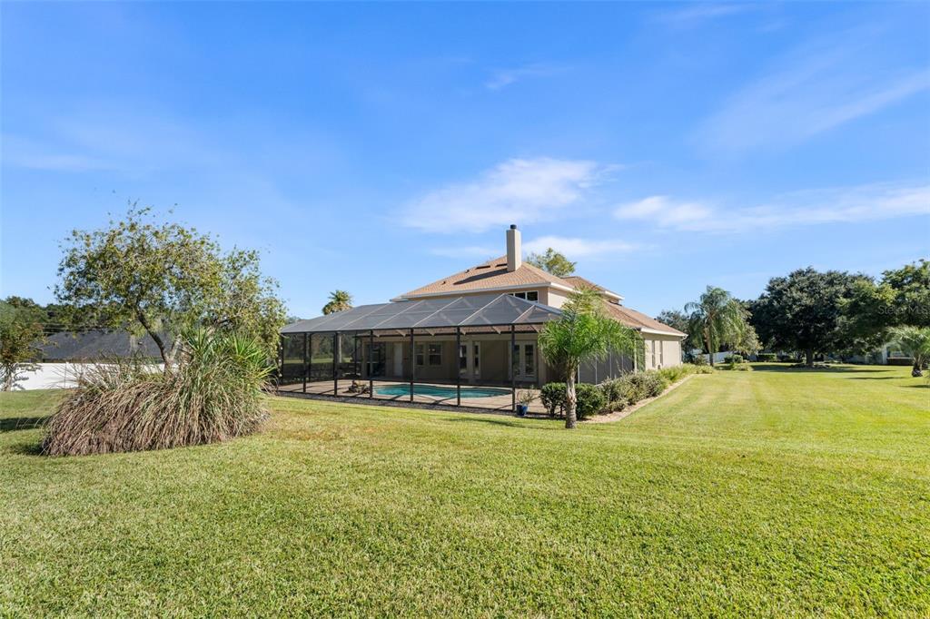 3950 Southeast 39th Circle Ocala, FL 34480 - Photo 38 of 40 a view of a house with swimming pool and porch