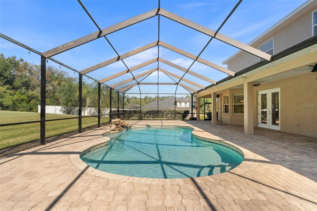 3950 Southeast 39th Circle Ocala, FL 34480 - Photo 4 of 40 a view of a swimming pool with a patio