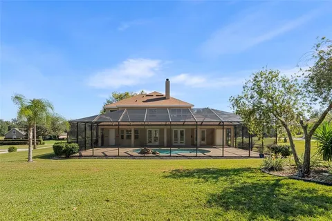 a front view of a house with a yard fountain