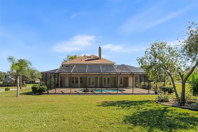 a front view of a house with a yard fountain