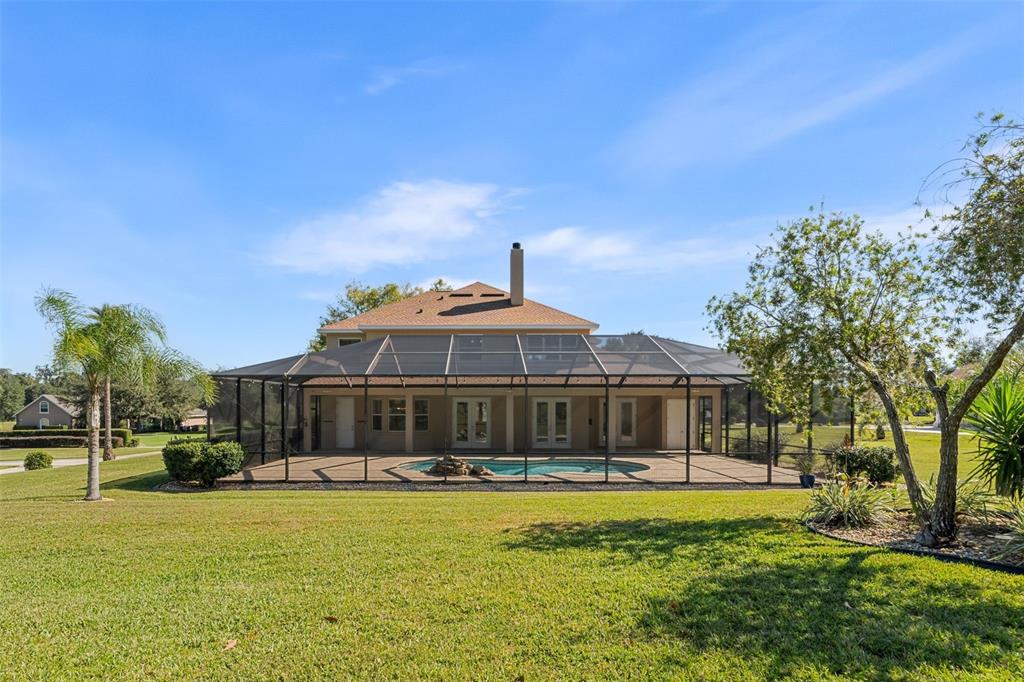 3950 Southeast 39th Circle Ocala, FL 34480 - Photo 5 of 40 a front view of a house with a yard fountain