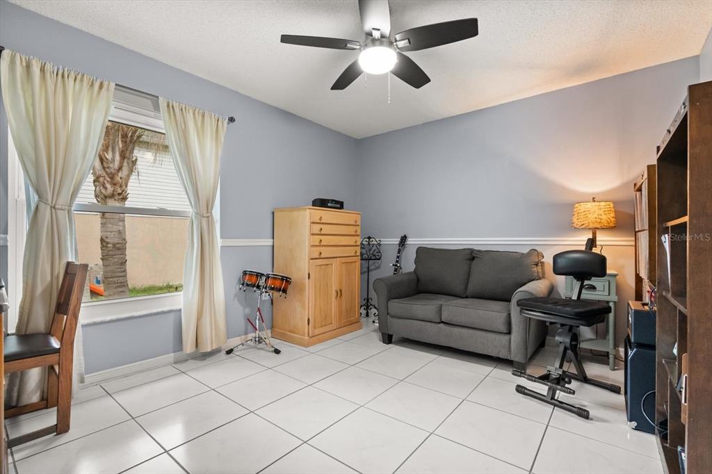 1336 Star Court Deltona, FL 32725 - Photo 27 of 34 a living room with furniture and a window