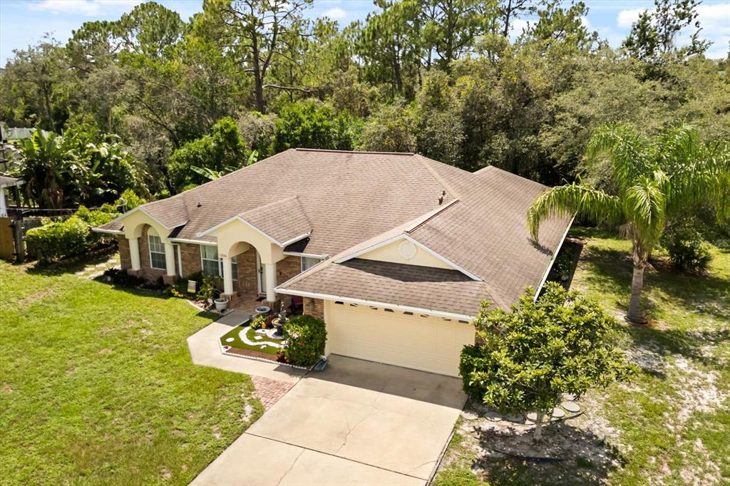 1336 Star Court Deltona, FL 32725 - Photo 3 of 34 a aerial view of a house with swimming pool next to a yard
