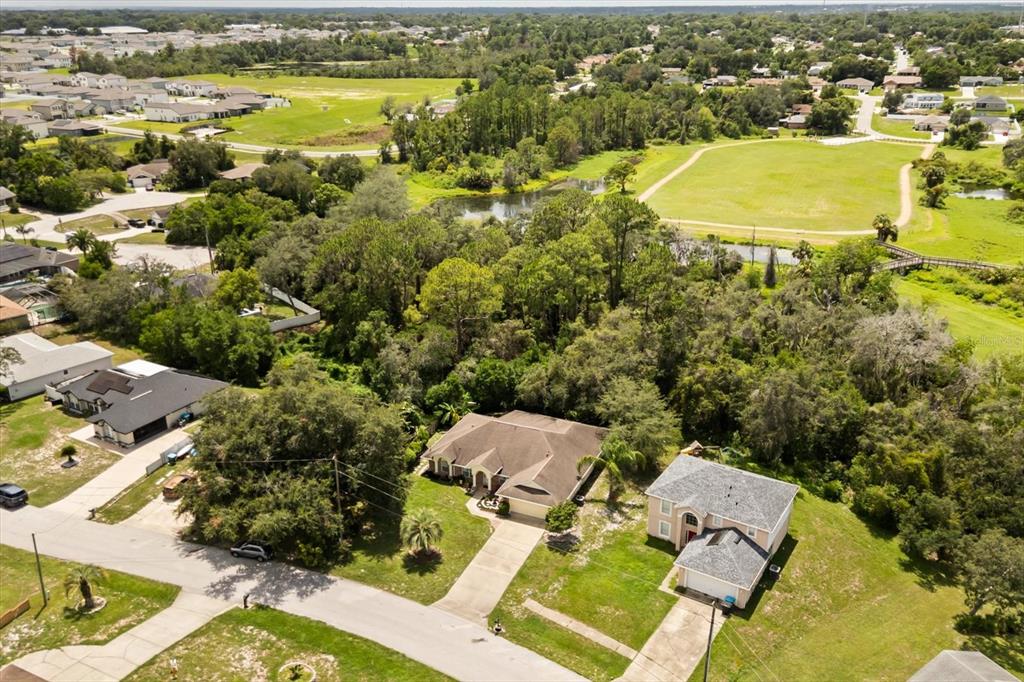 1336 Star Court Deltona, FL 32725 - Photo 5 of 34 an aerial view of residential houses with outdoor space and swimming pool