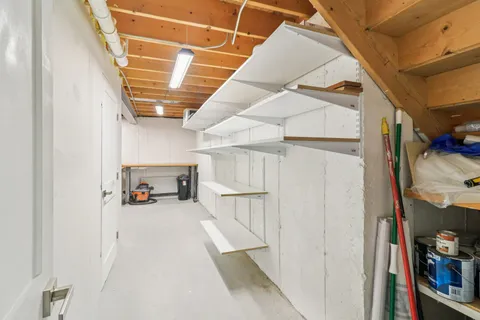 a view of a storage & utility room with two washing machine