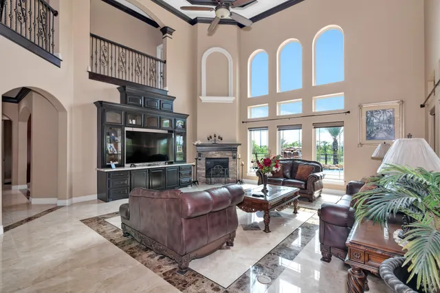 a living room with furniture fireplace and flat screen tv