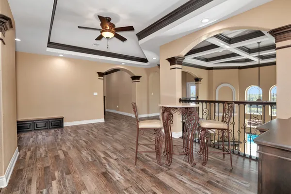 a view of a dining room with furniture window and wooden floor