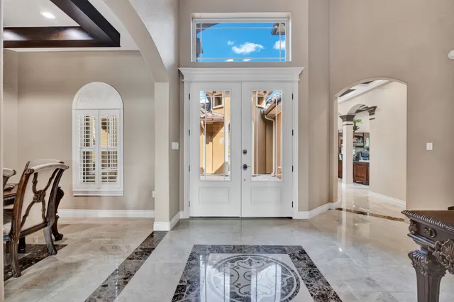 a view of a livingroom with furniture and windows