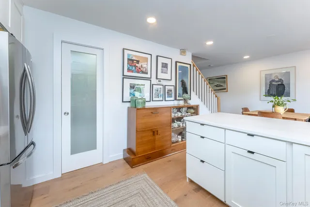 a spacious bathroom with a double vanity sink a mirror and a shower