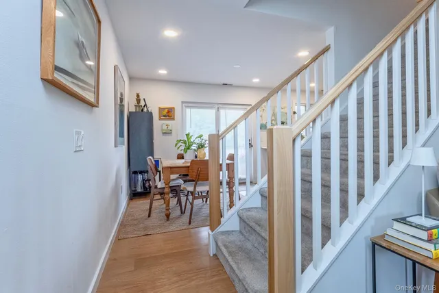 a view of a dining room with furniture and entryway