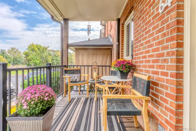 a view of balcony with wooden floor