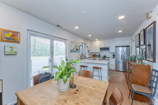 a kitchen with a table and chairs