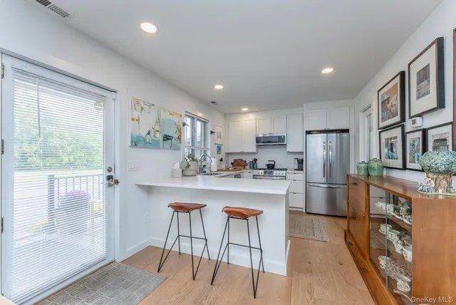 a kitchen with refrigerator and window