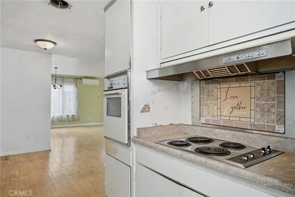 a kitchen with stainless steel appliances granite countertop a stove and a refrigerator