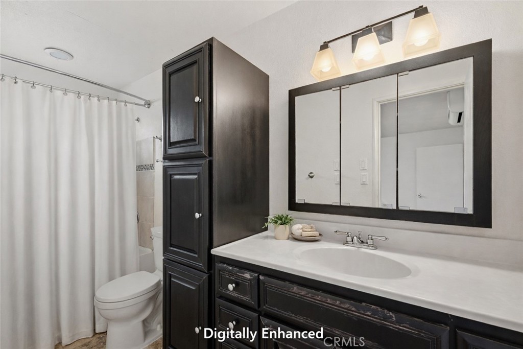 15050 Lakeview Way Clearlake, CA 95422 - Photo 17 of 24 a bathroom with a sink and a mirror