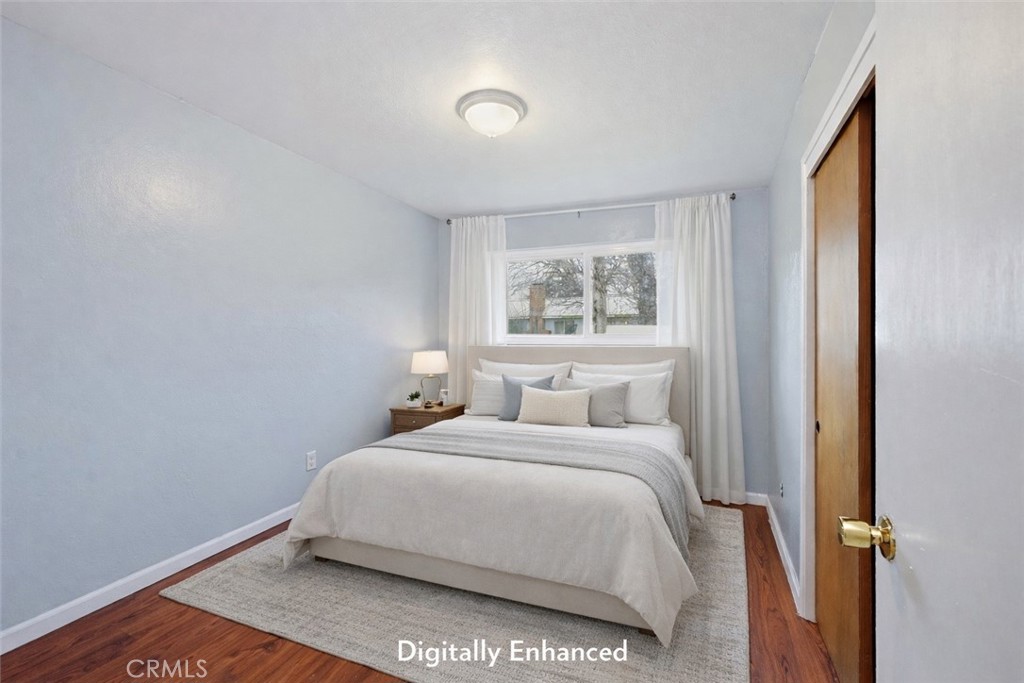 15050 Lakeview Way Clearlake, CA 95422 - Photo 19 of 24 a bedroom with a bed and a window