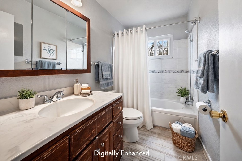 15050 Lakeview Way Clearlake, CA 95422 - Photo 23 of 24 a bathroom with a granite countertop sink toilet and shower