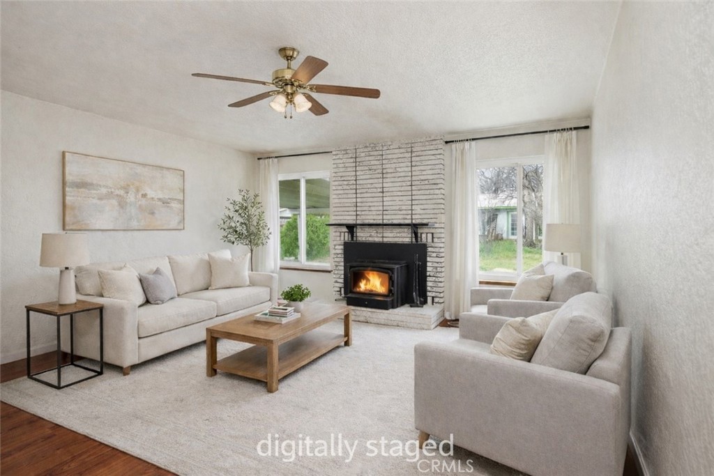 15050 Lakeview Way Clearlake, CA 95422 - Photo 5 of 24 a living room with furniture and a fireplace