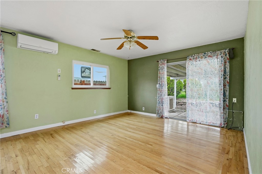 15050 Lakeview Way Clearlake, CA 95422 - Photo 6 of 24 wooden floor in an empty room with a window