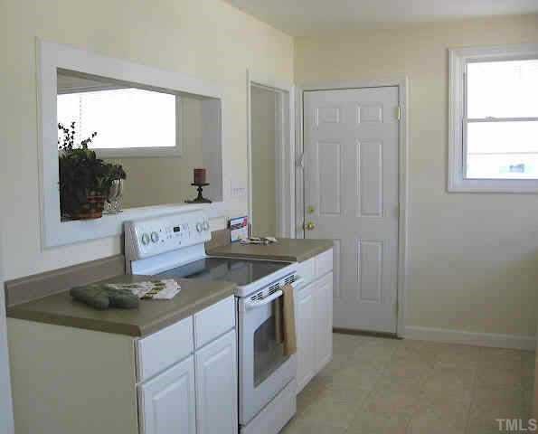 726 East Whitaker Mill Road Raleigh, NC 27608 - Photo 4 of 8 a kitchen with a sink and cabinets