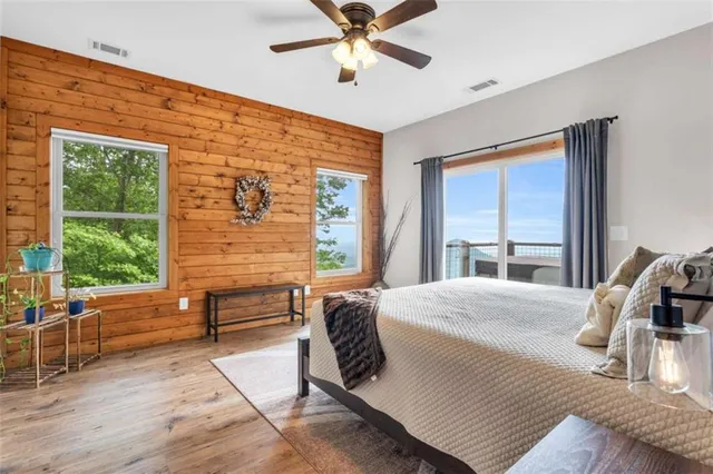 a bedroom with a bed couch and a window