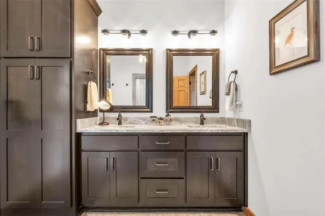 a bathroom with a toilet a sink and shower